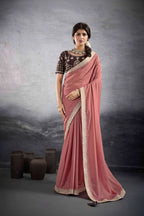 A side-by-side catalog display of a model wearing a dusty pink georgette saree with a dark brown embroidered blouse. The left side shows the full length of the saree draped elegantly, while the right side shows a closer view of the blouse embroidery and drape.