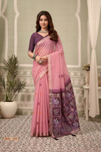 Woman wearing a pink saree with a mirror reflection, Gobuni brand visible