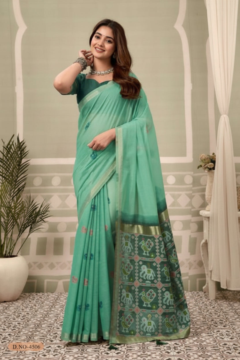 Woman in a green saree with a decorative background and 'Gobuni' branding.