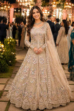Woman in an embroidered traditional outfit at a festive event