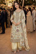 Woman in traditional embroidered outfit at a festive outdoor event
