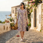 Woman wearing lavender leaf print cotton A-line kurti with round neck and 3/4 sleeves