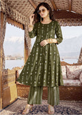 Woman wearing a green traditional outfit with a scenic background