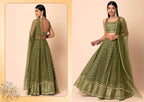 An olive green embroidered lehenga choli set shown on a model from both front and back views against a warm beige background.
